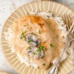 slow cooker chicken marsala with rice served with two forks