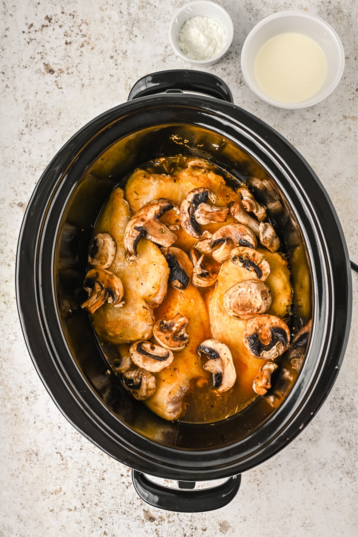 Prepared chicken marsala ready for slow cooking
