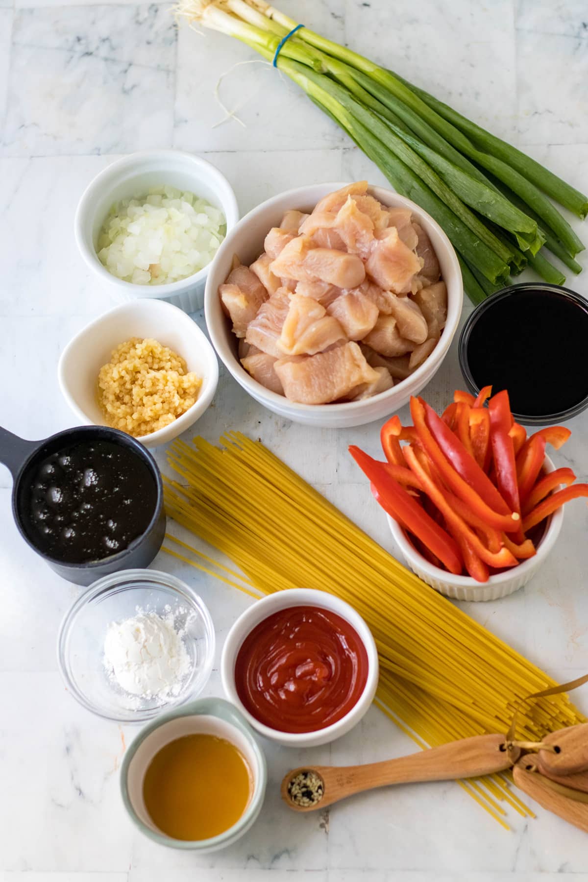 Separate bowl of ingredients of a delicious slow cooker honey garlic chicken and noodles
