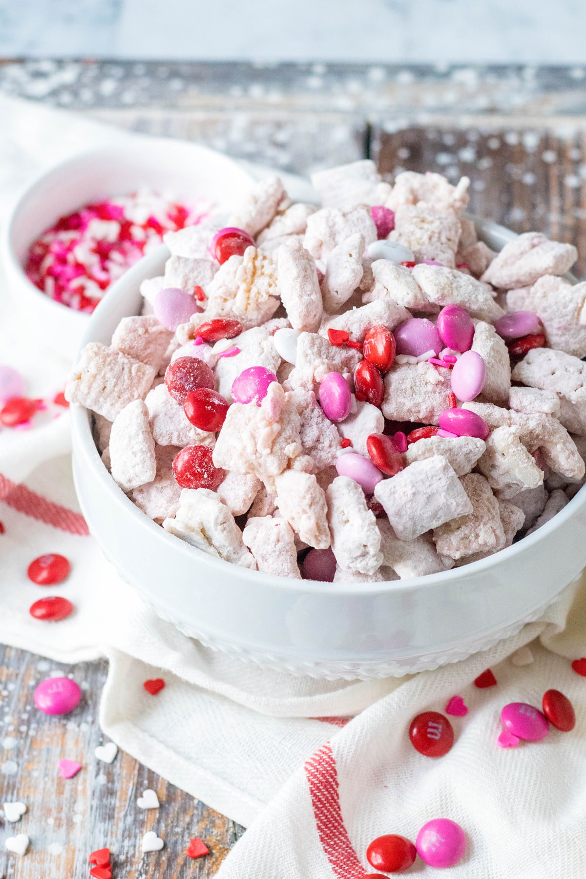 A bowl of strawberry puppy chow with sprinkles on top