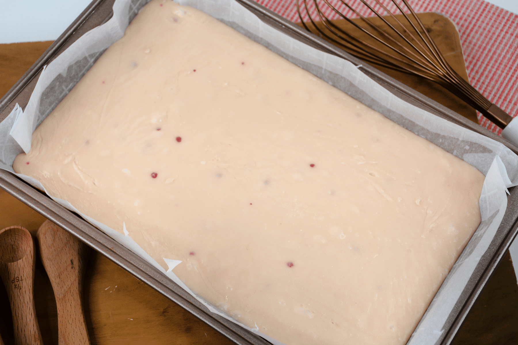 Next process in preparing White Chocolate Strawberry Fudge is to put strawberry fudge into the baking dish and spread evenly.