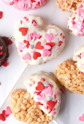 white chocolate and sprinkles on heart krispies treats