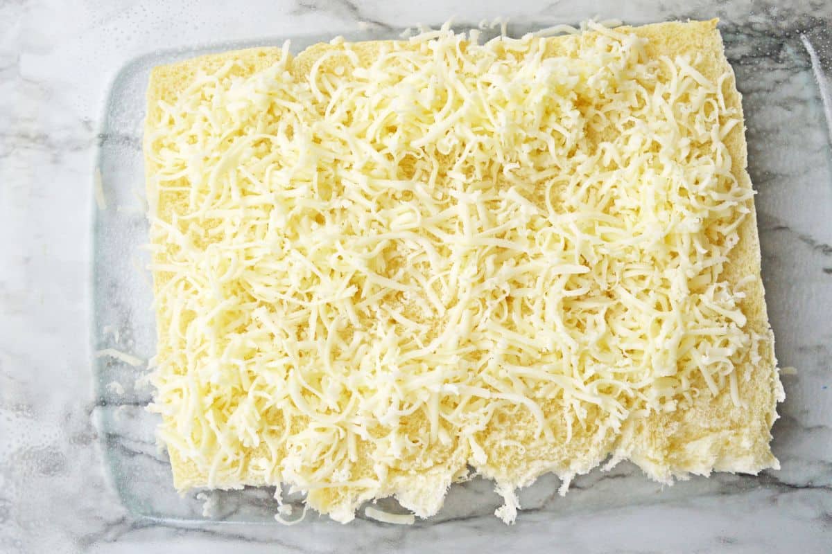 shredded mozzarella cheese on bread