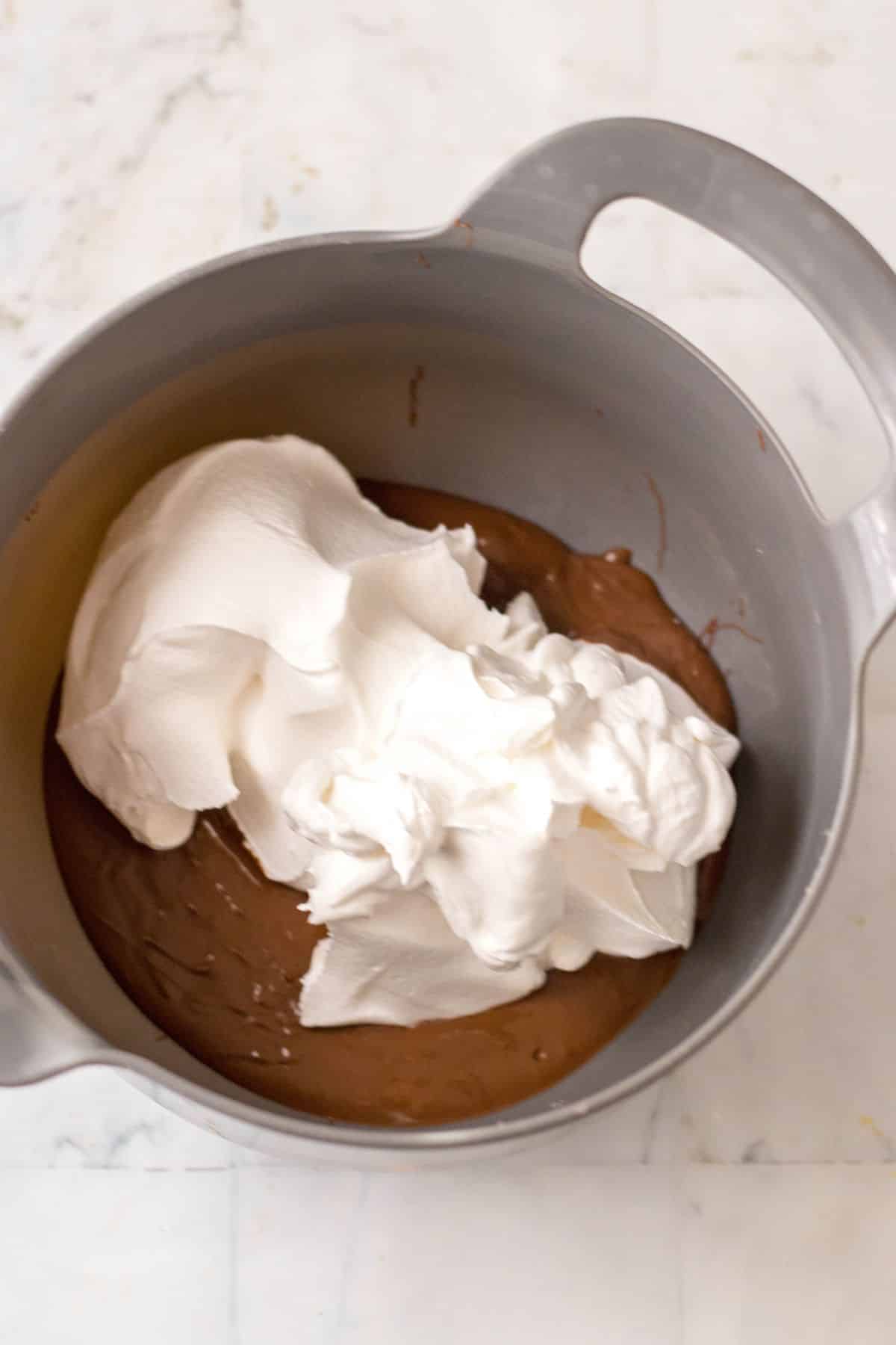 melted chocolate and whipped topping in sauce pan