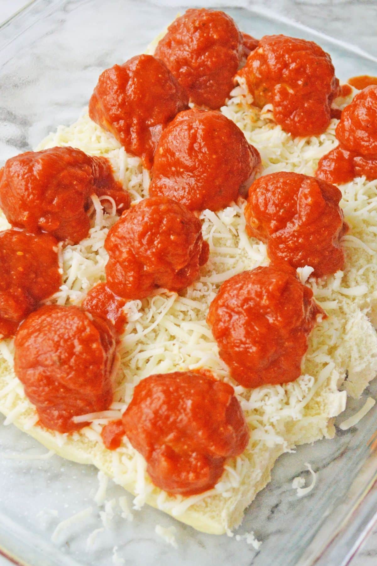 meatballs with sauce on cheese and bread
