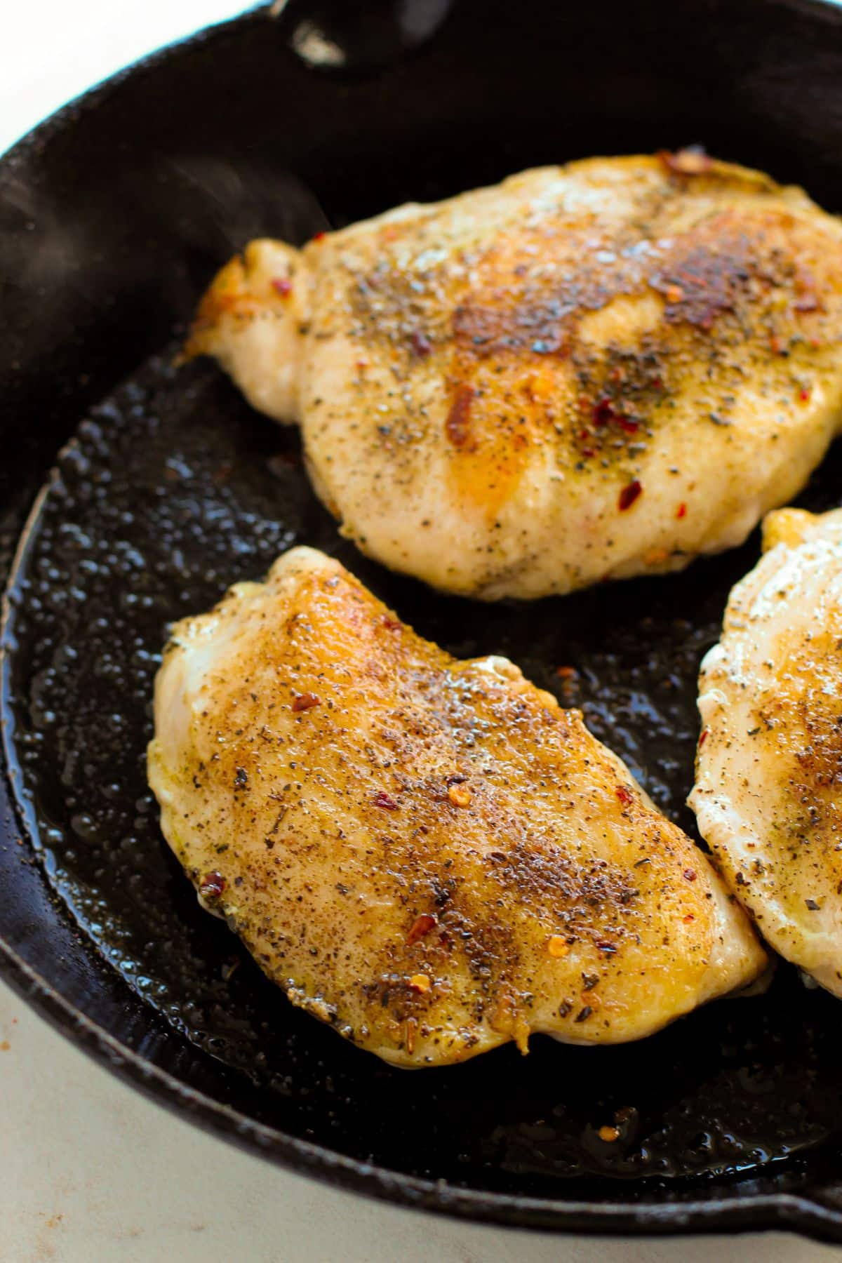 seared chicken in cast iron pan