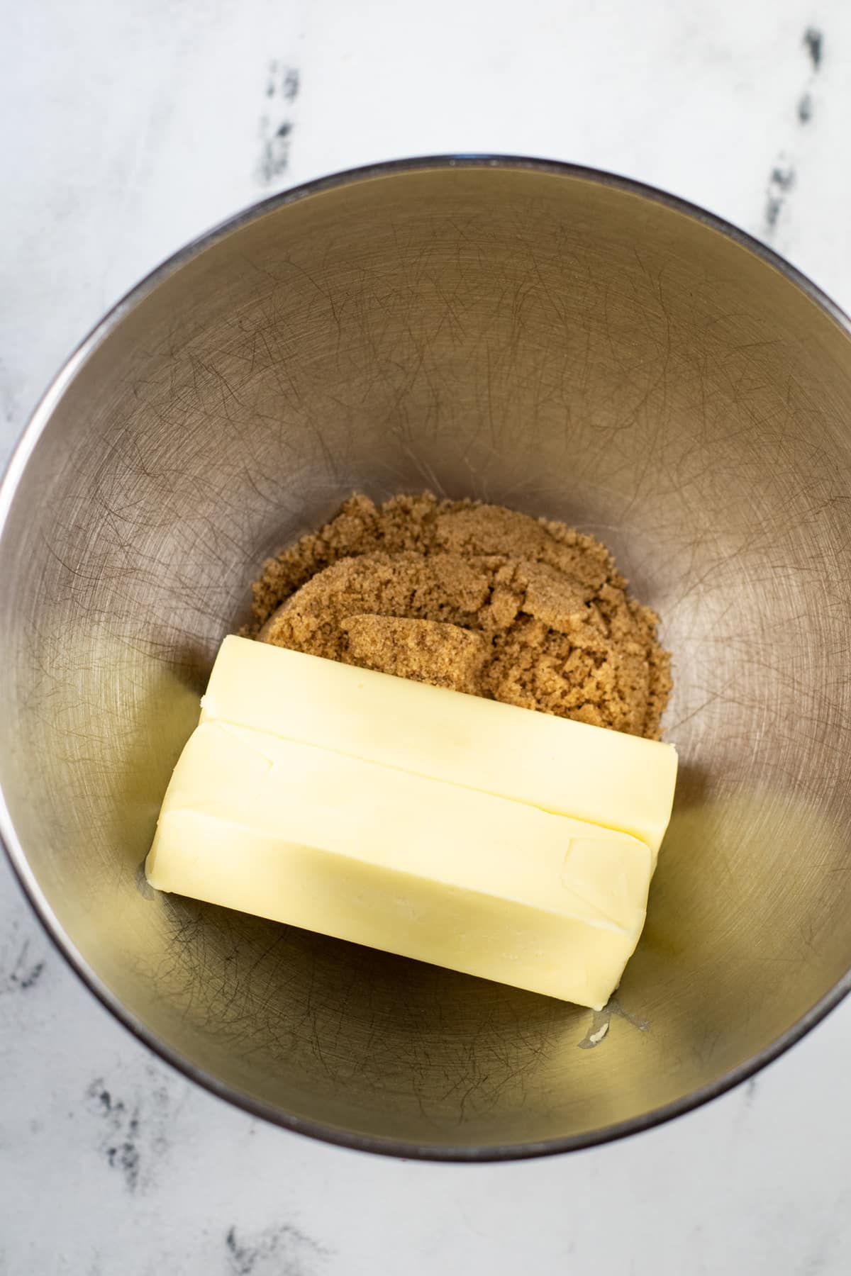 Brown sugar and butter in a mixer bowl