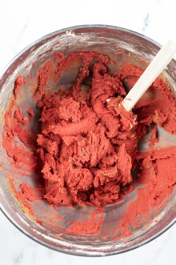 The cookie dough with added food coloring in deep red