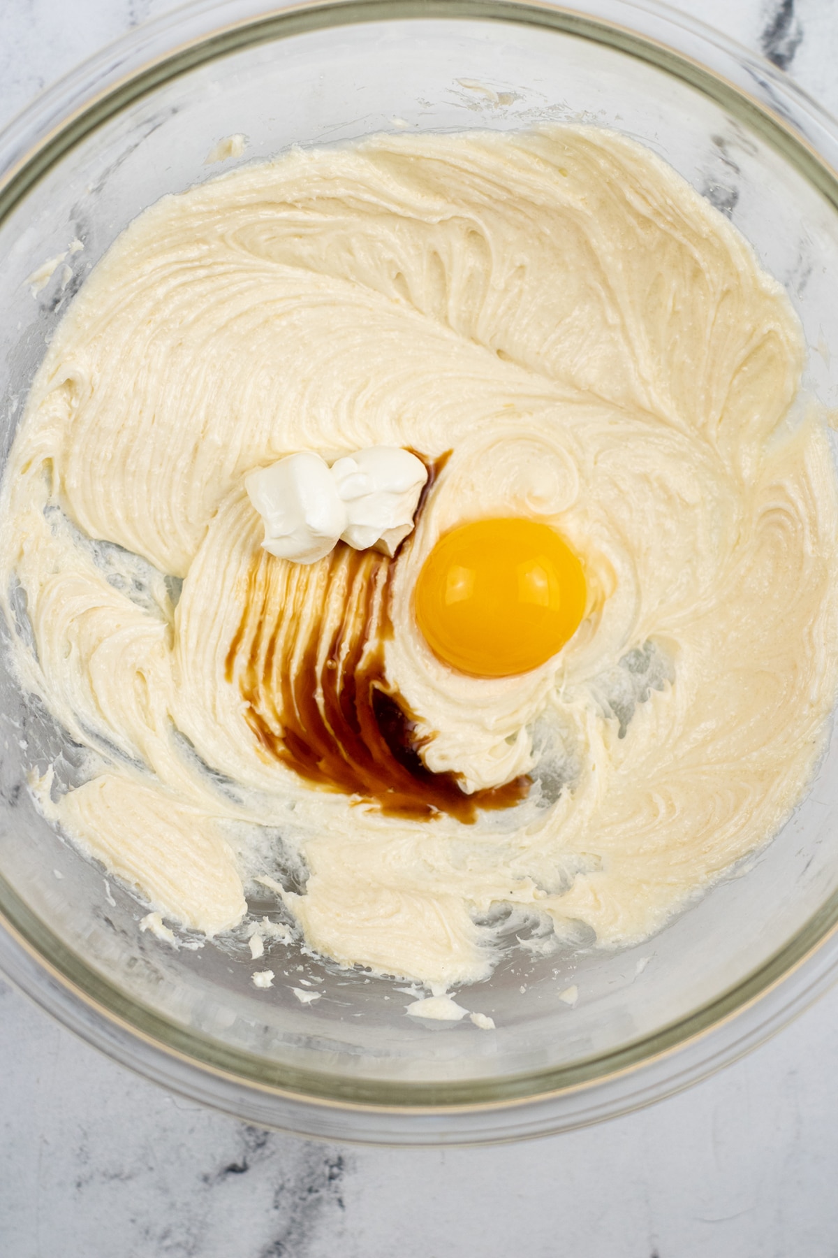 Cream cheese mixture in addition with egg, sour cream, salt and vanilla