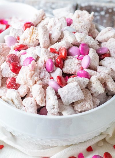 white puppy chow with pink and red candies