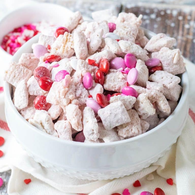 white puppy chow with pink and red candies
