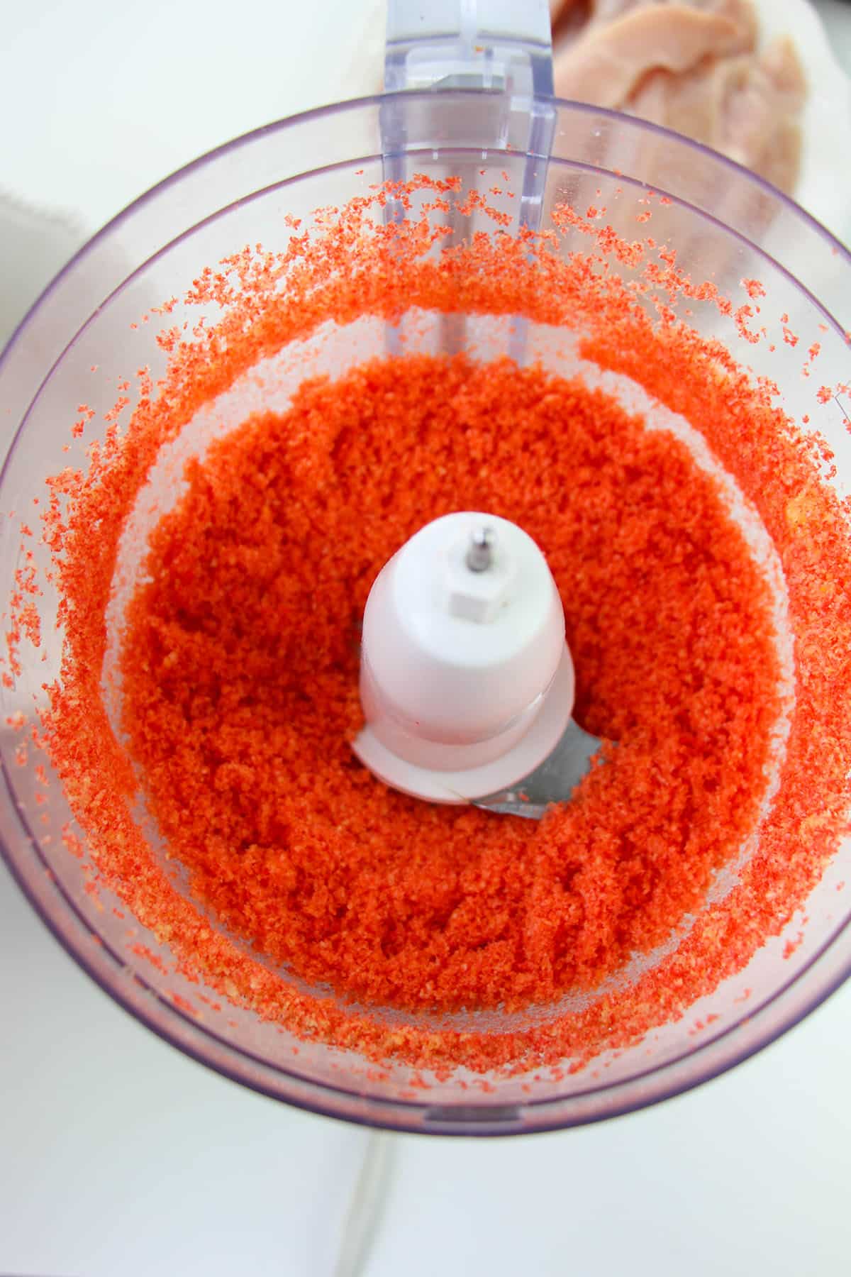 Crushed hot cheetos in a food processor
