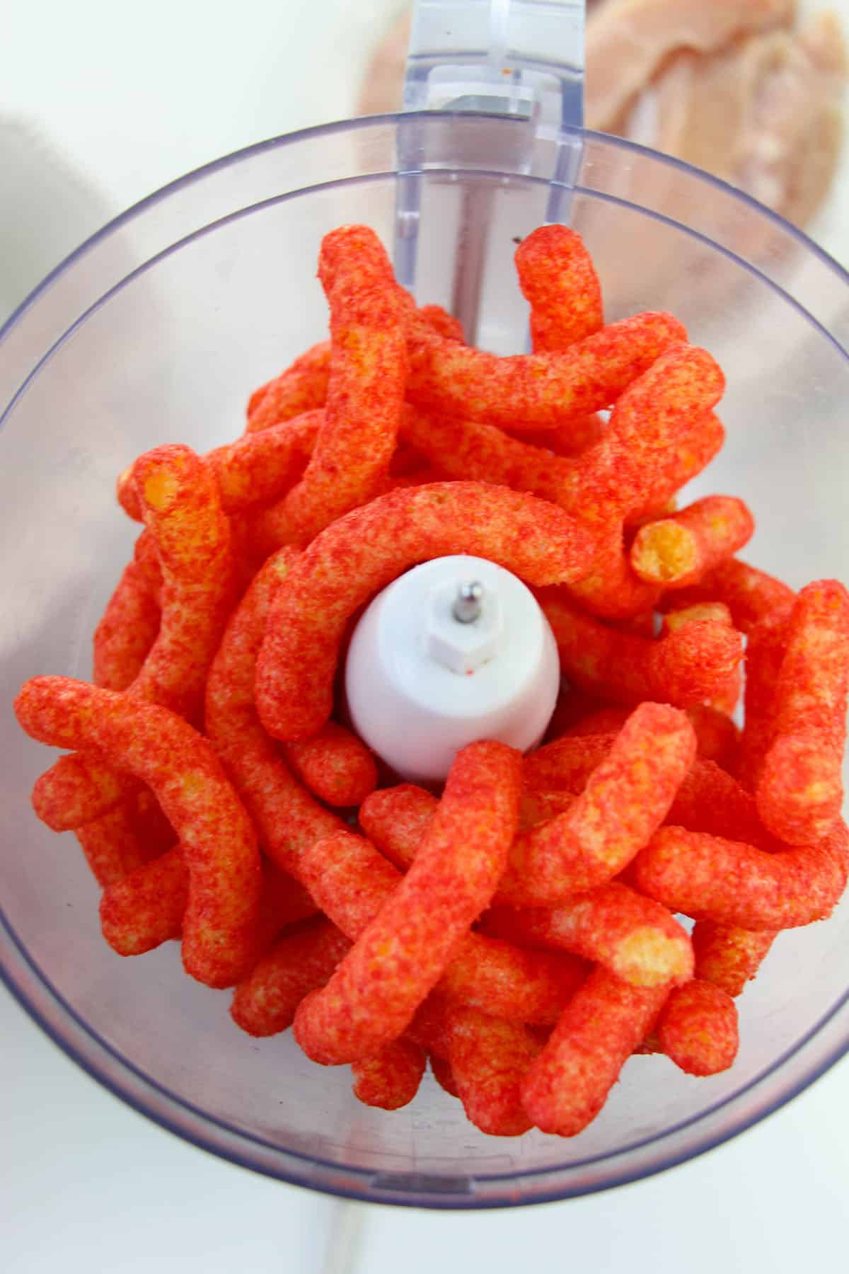 Hot Cheeto puffs in a food processor