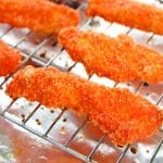 Baked hot Cheeto chicken tenders in a rack