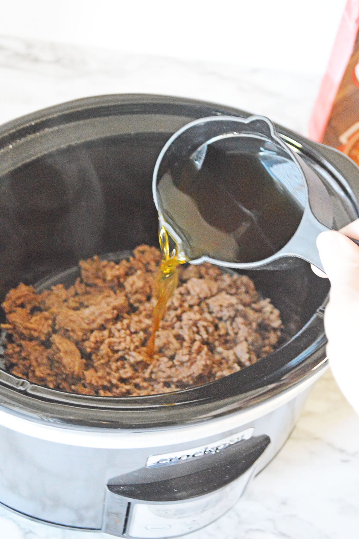 Crockpot with ground beef and broth
