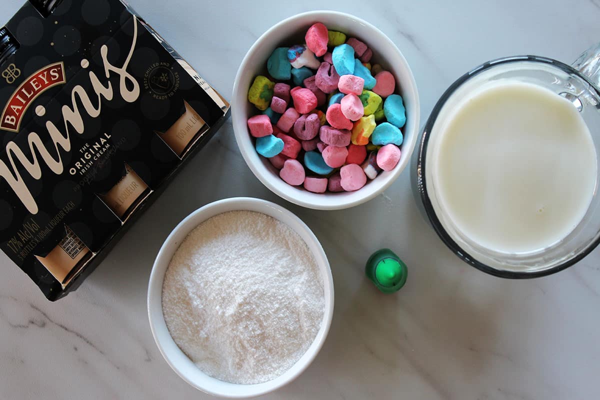 Baileys mini bottle, milk, vanilla pudding and colorful marshmallows