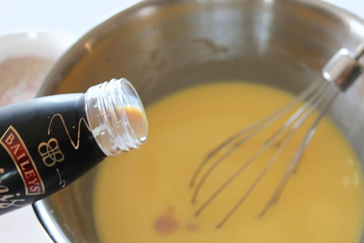 Pudding mixture with Baileys liquor added in the mixing bowl