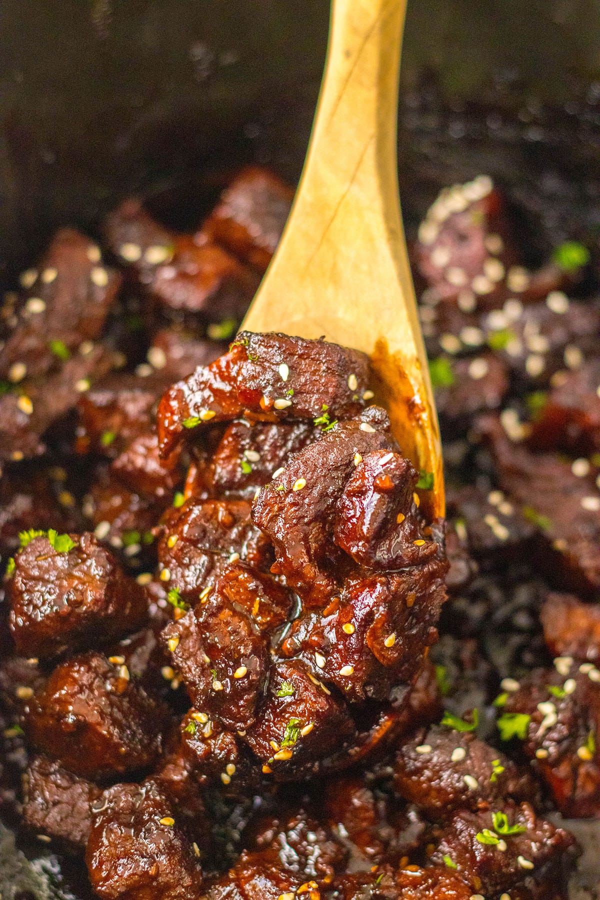 Tasty look of the steak bites with a wooden ladle
