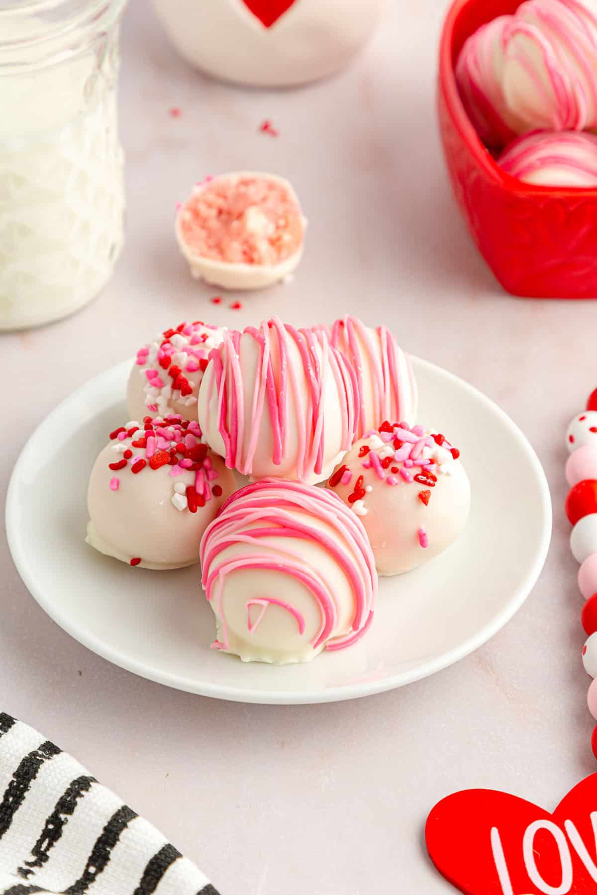 Strawberry cheesecake balls wonderfully decorated in pink and red color candies