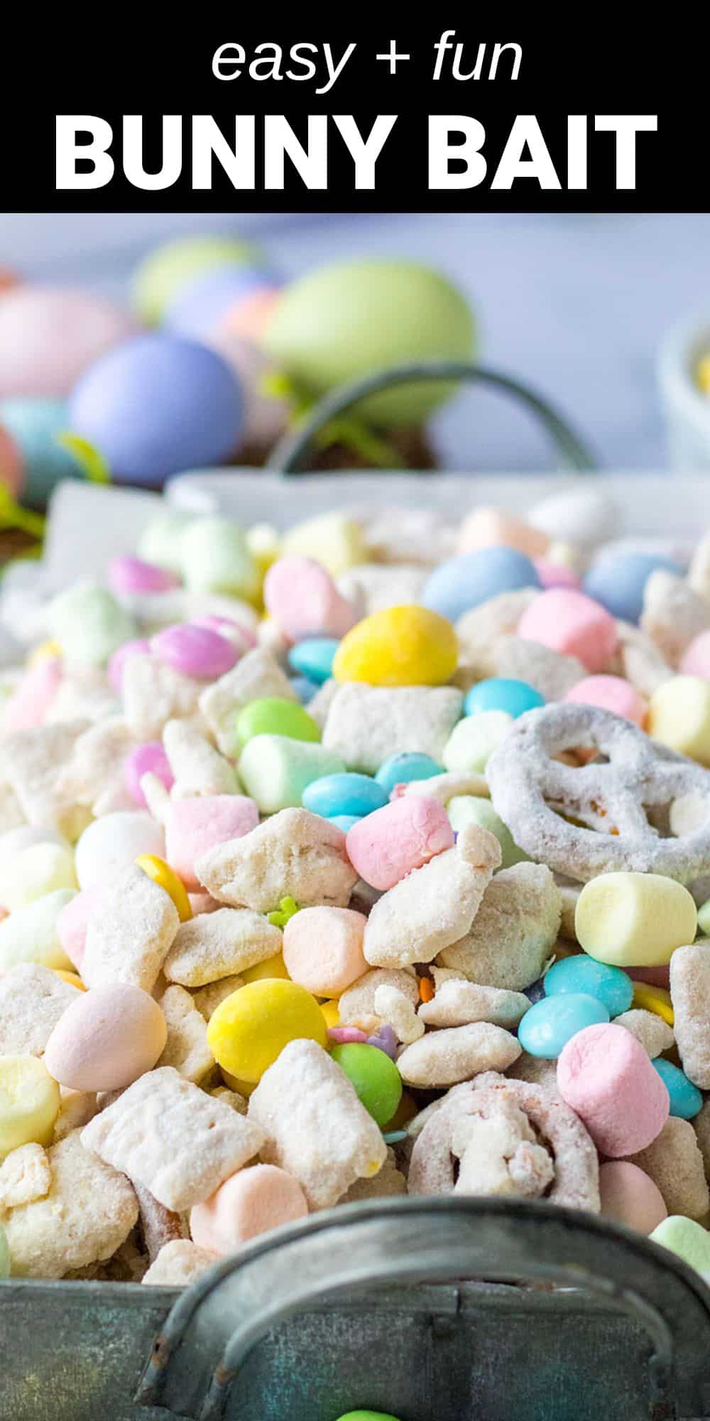 This Bunny Munch is so delicious and such a cute treat for Easter! Funfetti cake mix coats this Bunny Munch that is full of treats like M&Ms and chocolate eggs.