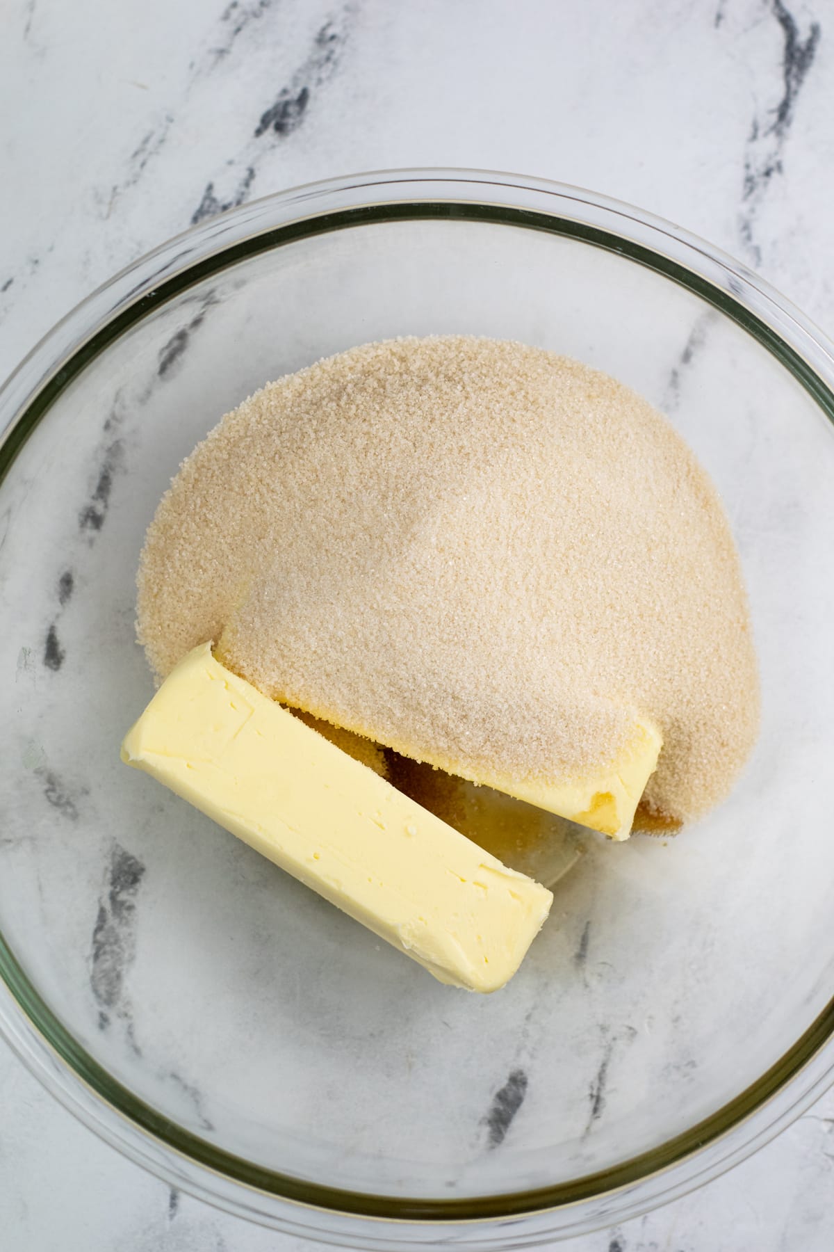 Next step in preparing Cranberry Orange Pound Cake is to add butter cream and sugar.