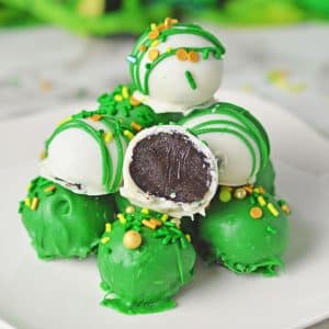 green and white Oreo balls on plate