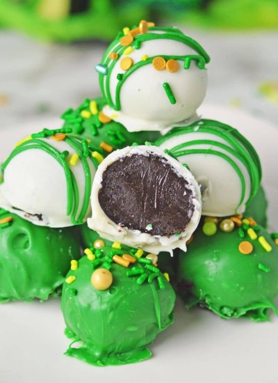green and white Oreo balls on plate