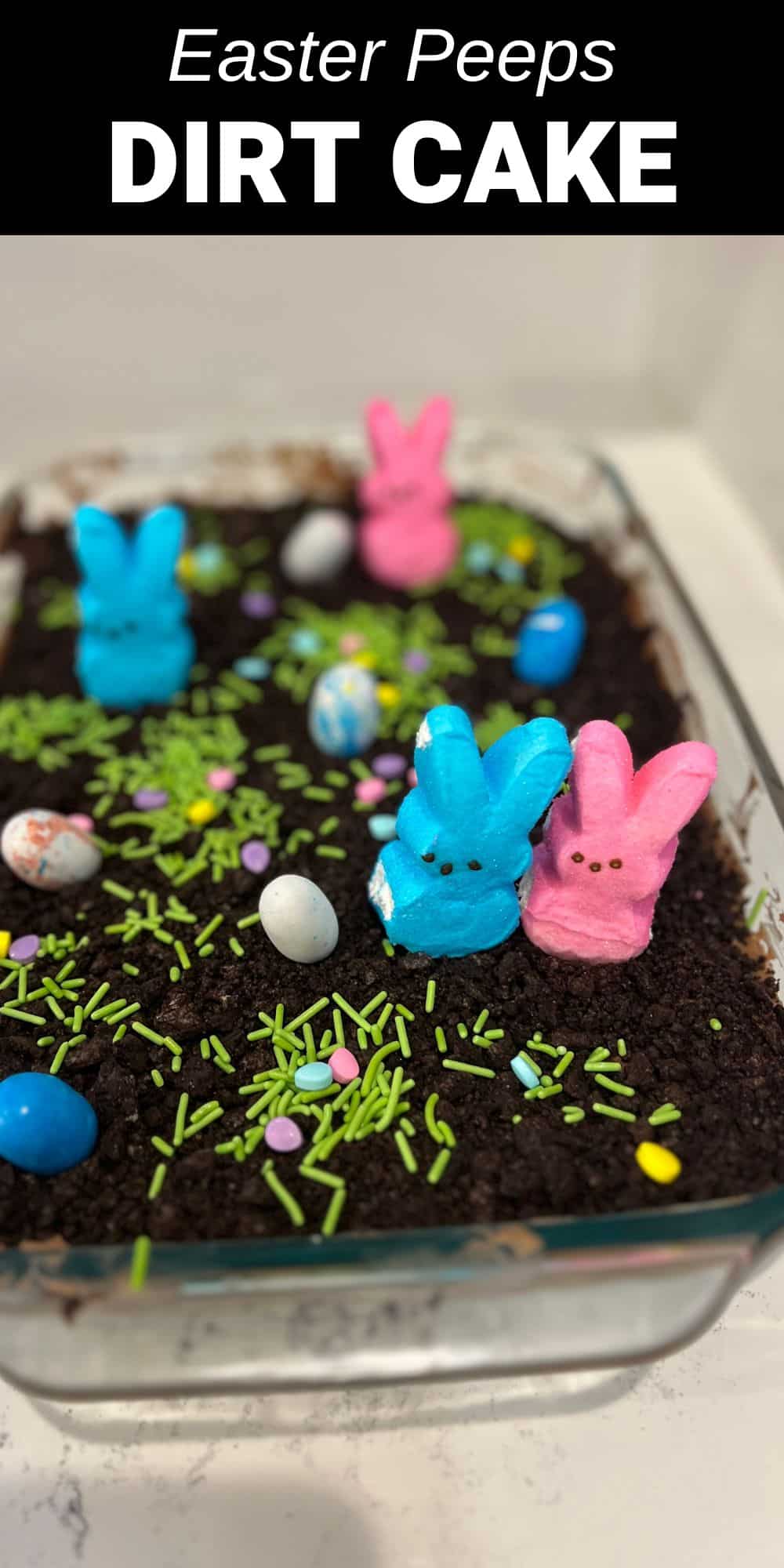 This Easter Dirt Cake is a fun no bake dessert to make for Easter that the kids love. With a crushed oreo crust and fluffy chocolate pudding center, this cake is topped with colorful Spring Easter peeps to make the cutest dessert.