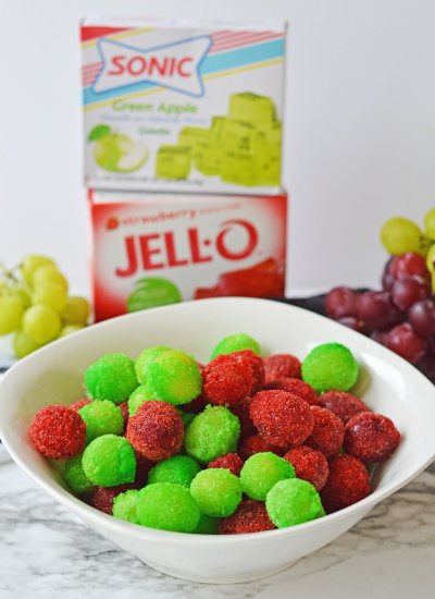 A colorful bowl of frozen grapes with jello