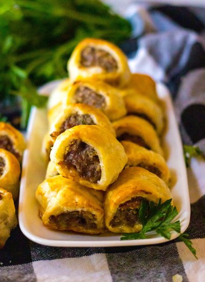 A serving of Sausage Rolls with Puffed Pastry on a white plate