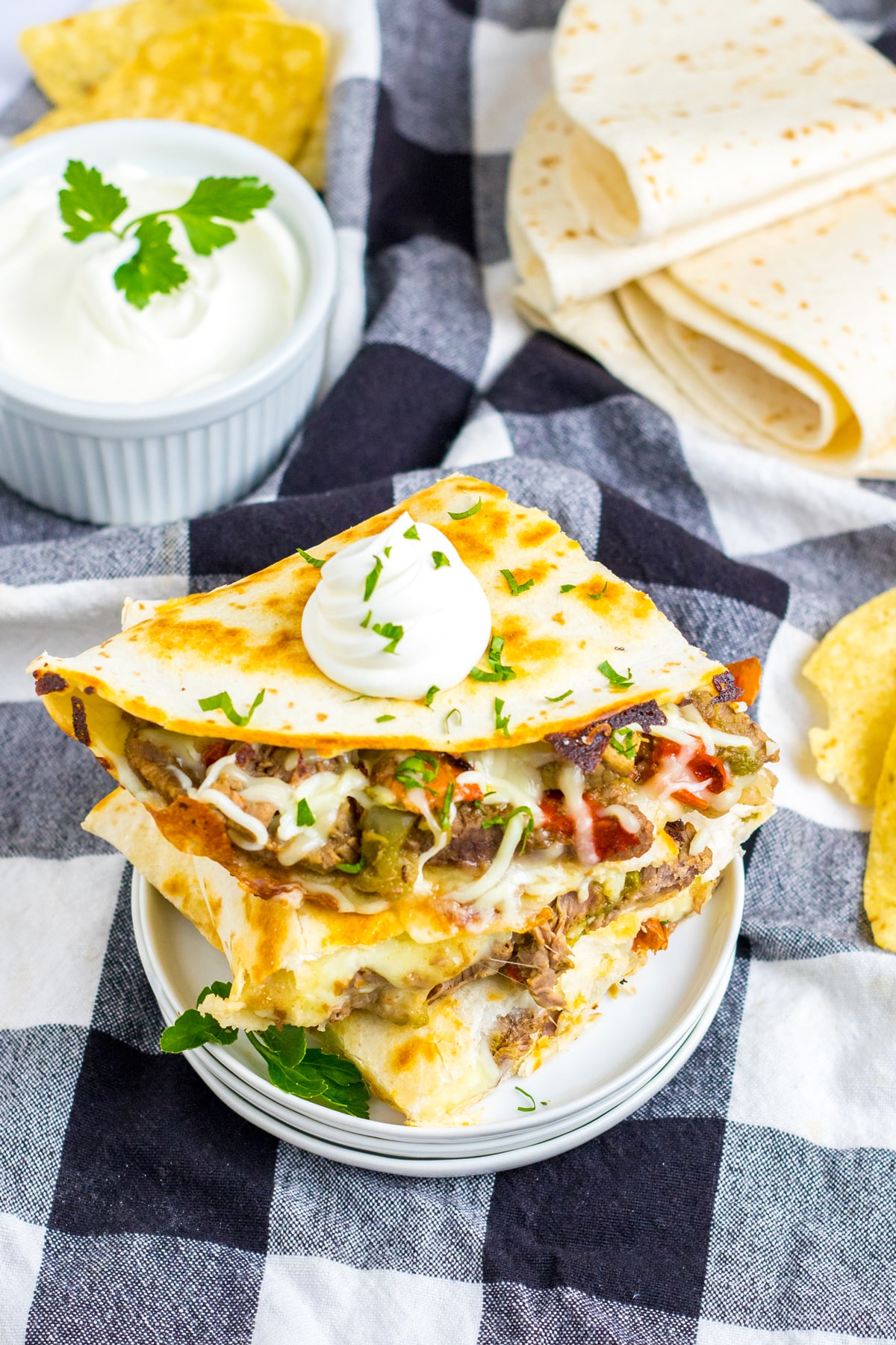 A serving of yummy Slow Cooker Cheesesteak Quesadillas on a serving plate