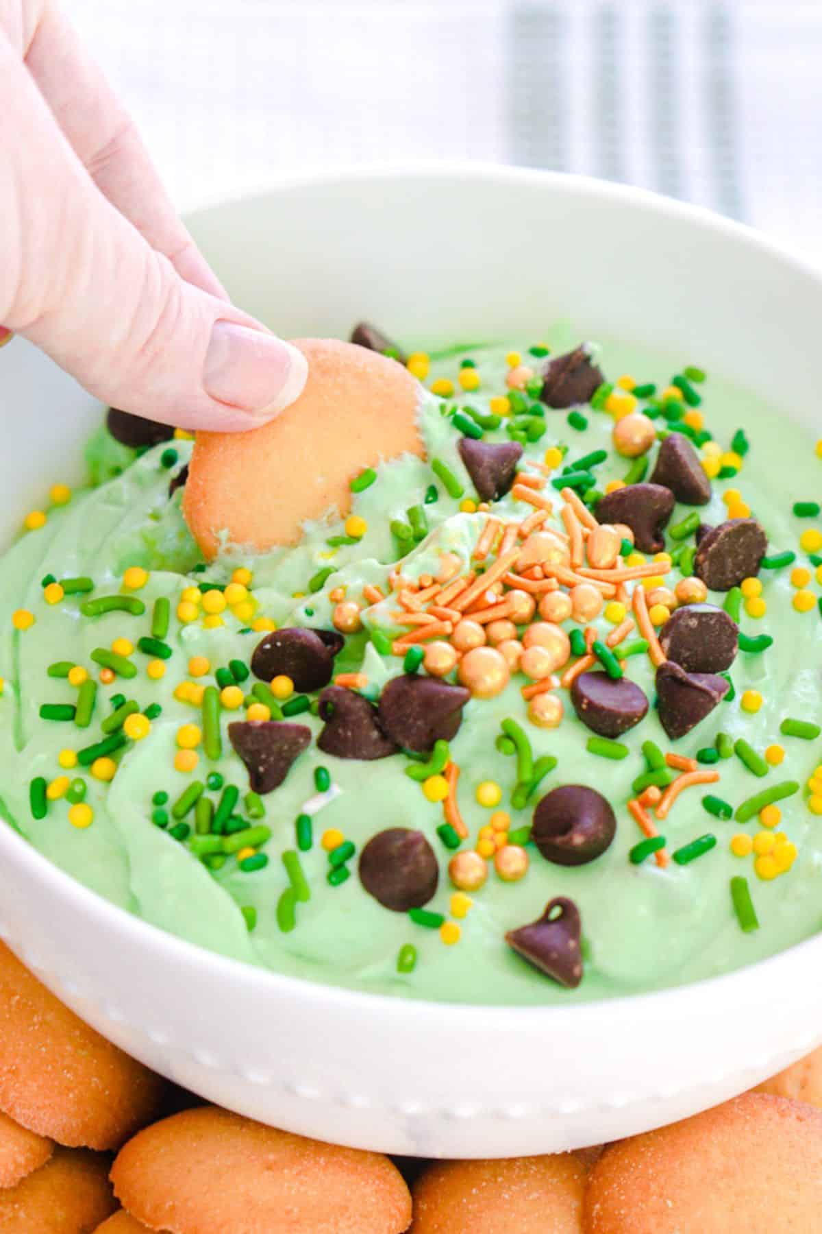green dip with green and gold sprinkles and chocolate chips
