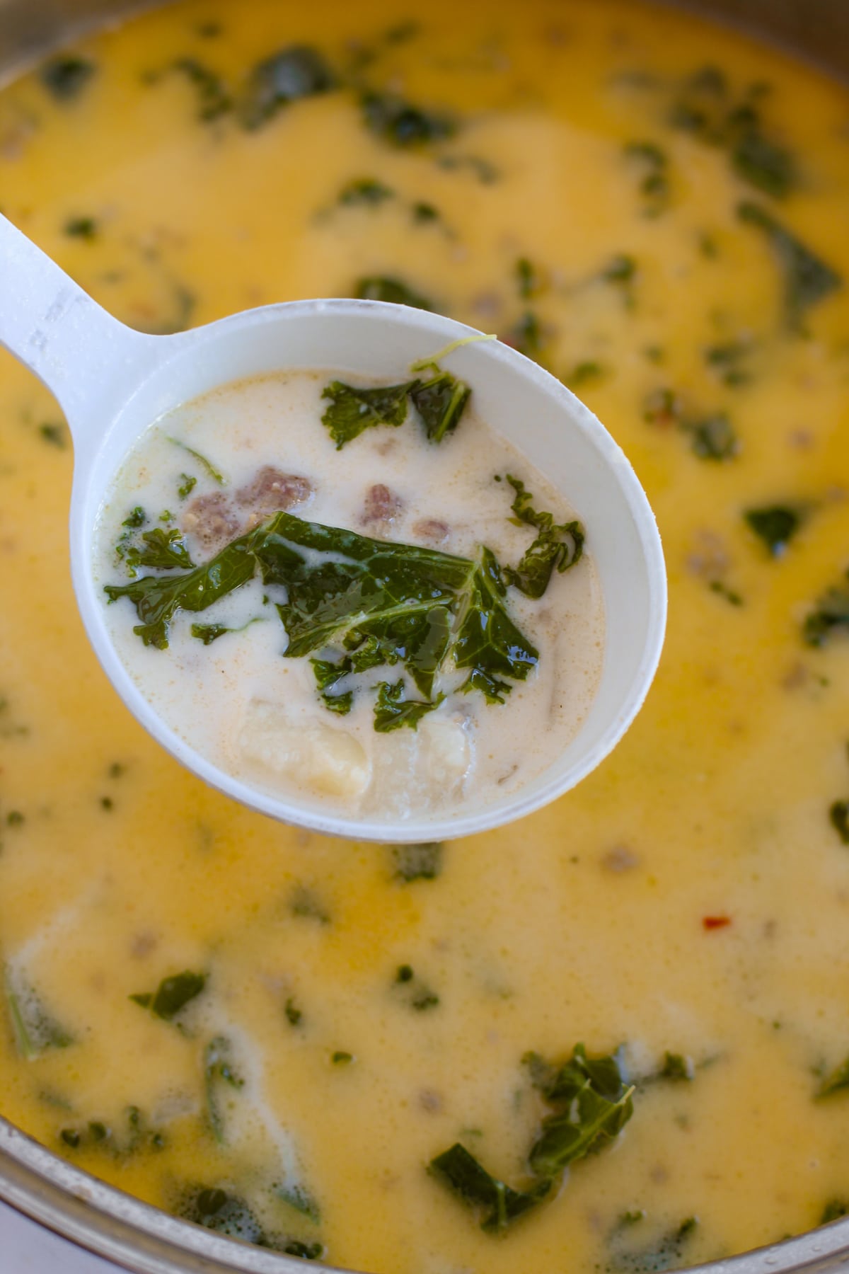 A spoonful of Olive Garden Zuppa Toscano Soup