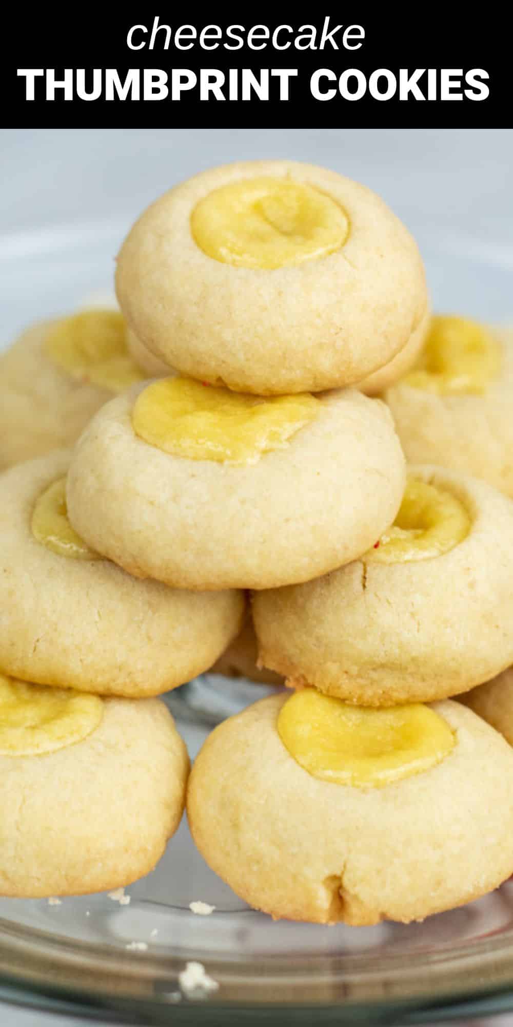 These cheesecake thumbprint cookies have everything you love about a sugar cookie and a cheesecake in one delicious dessert. A lightly sweet and buttery cookie forms the base for this treat and acts almost like a crust that holds the sweet and creamy cheesecake filling.