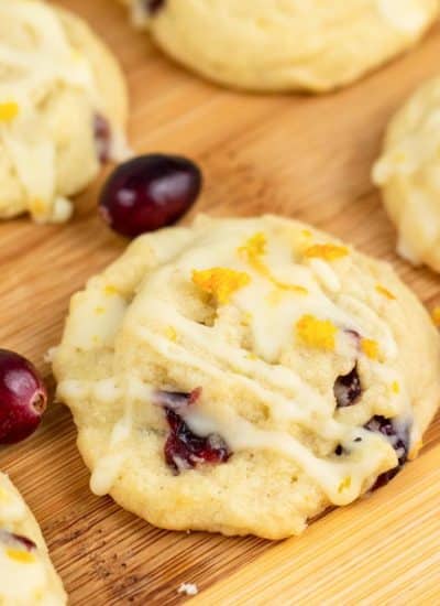 Cranberry orange cookies on a wooden surface.