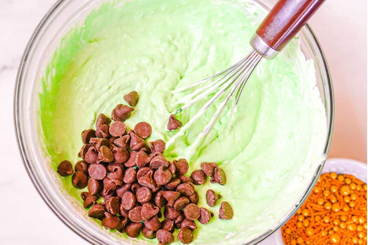 green cream cheese mixture with chocolate chips on the side