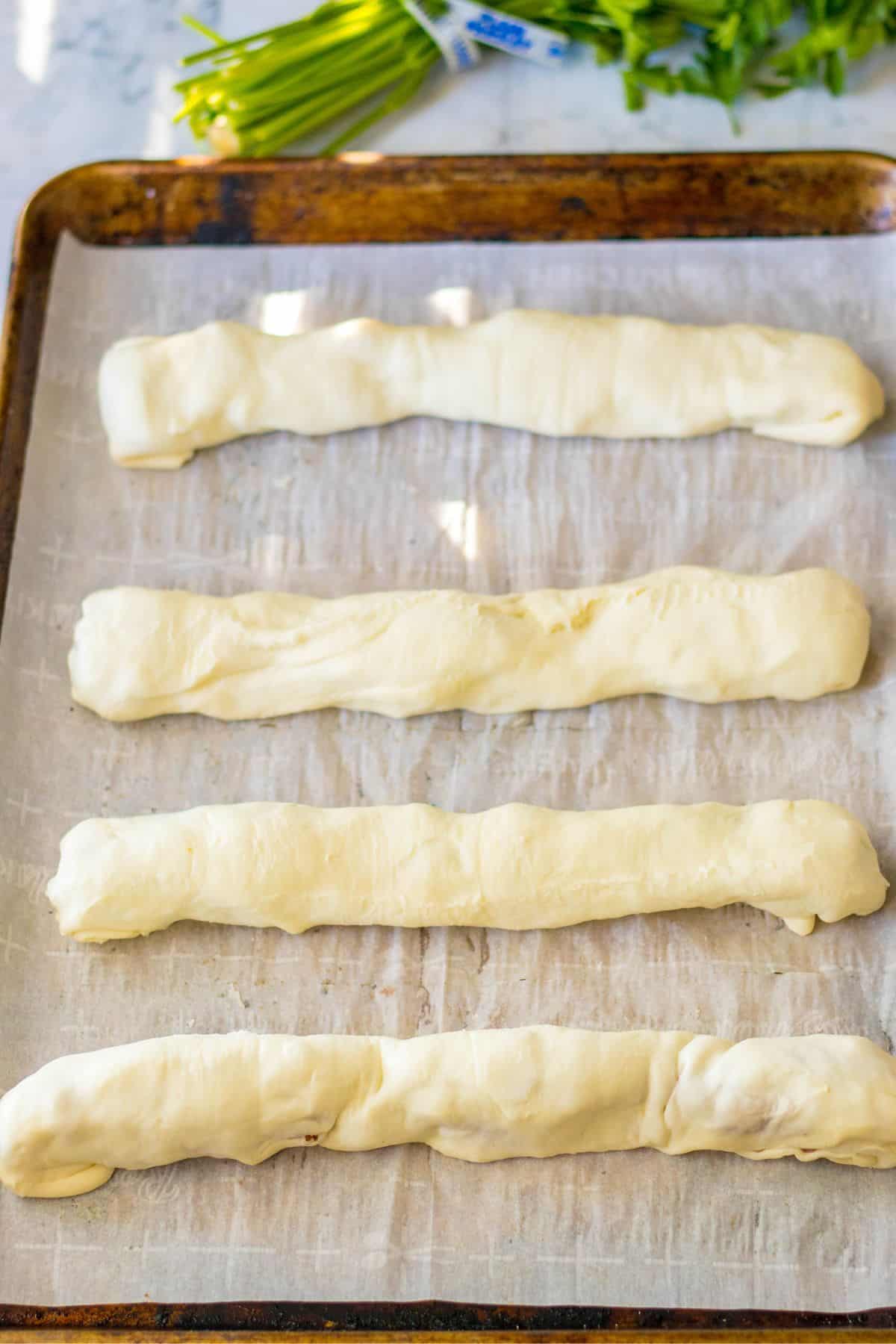 rolled puffed pastry on pan