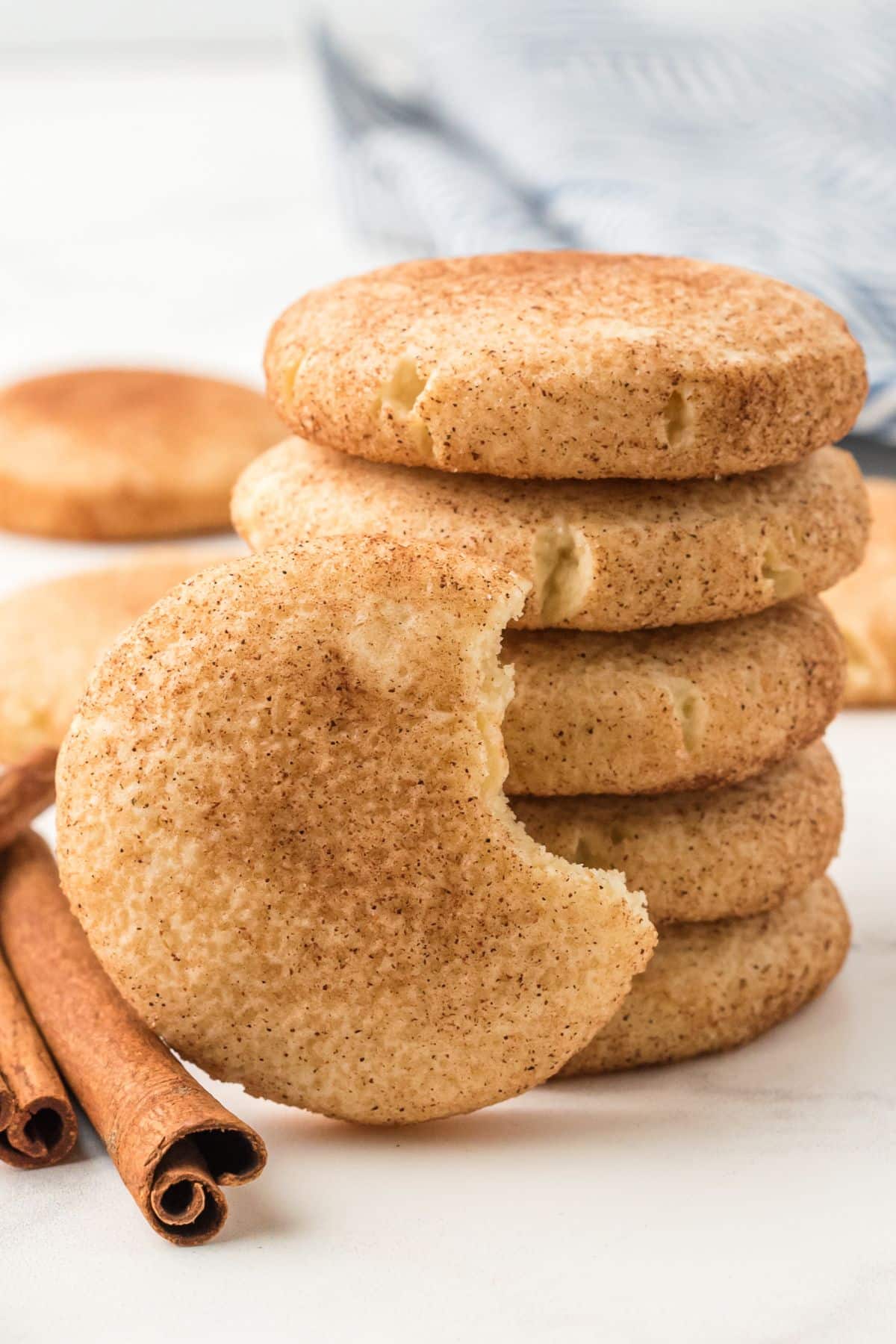 stacked snickerdoodle cookies with cinnamon stick