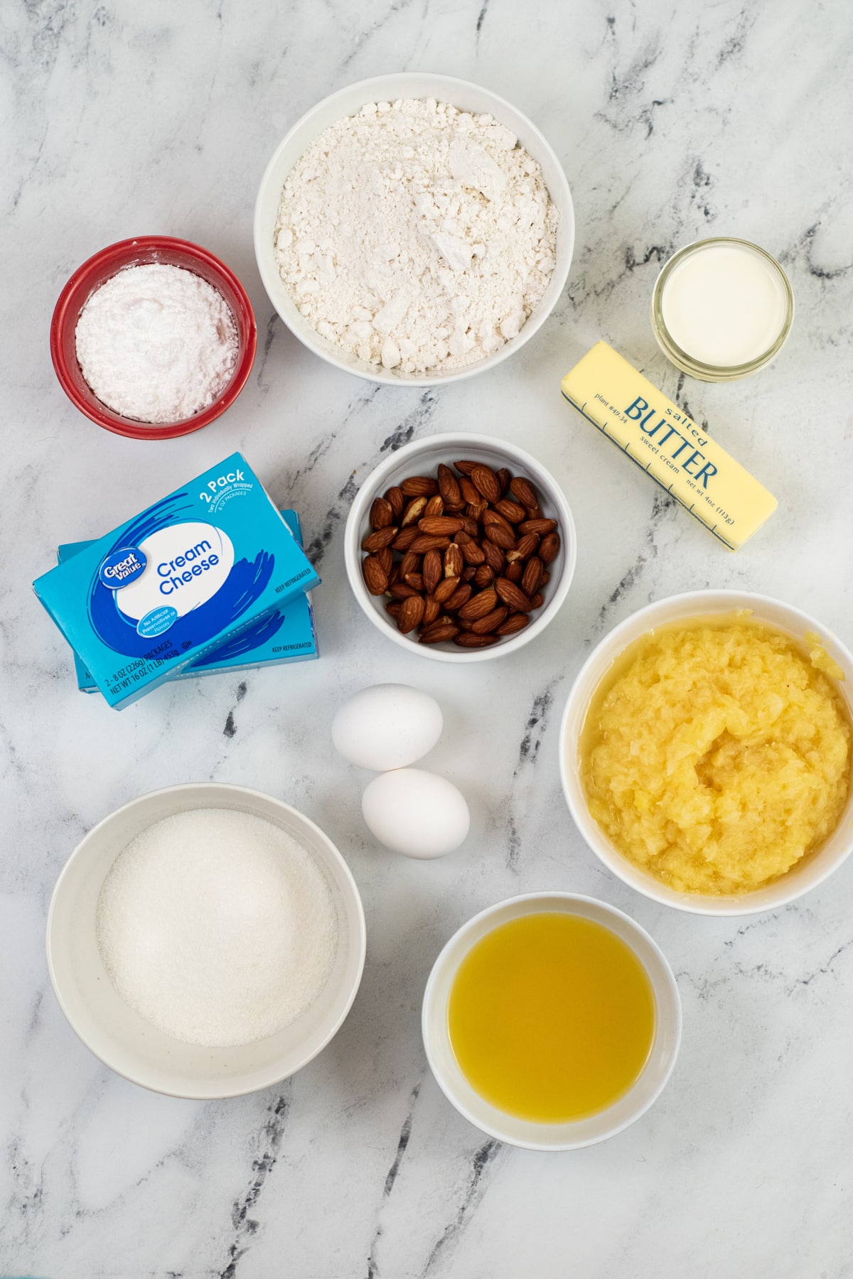 Ingredients for Pineapple Cheesecake Bars are the following: eggs, cream cheese, butter, crushed pineapples. pineapple juice, whipping cream and sugar
