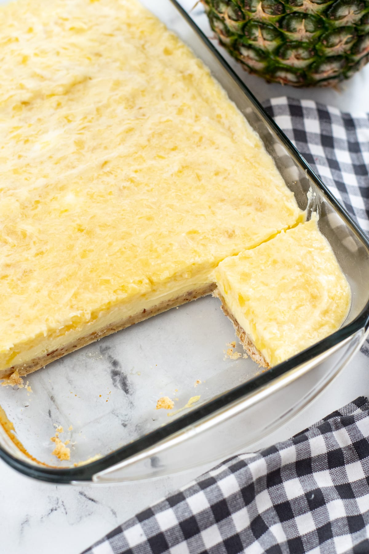 Slices of Pineapple Cheesecake Bars on a tray