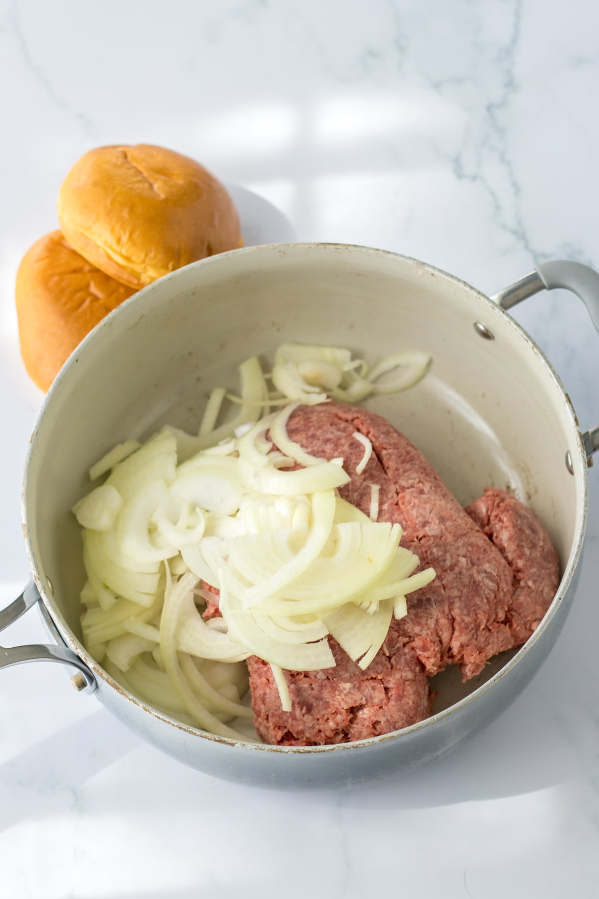 Browning the ground beef and onions is another process for Slow Cooker French Dip Sloppy Joes