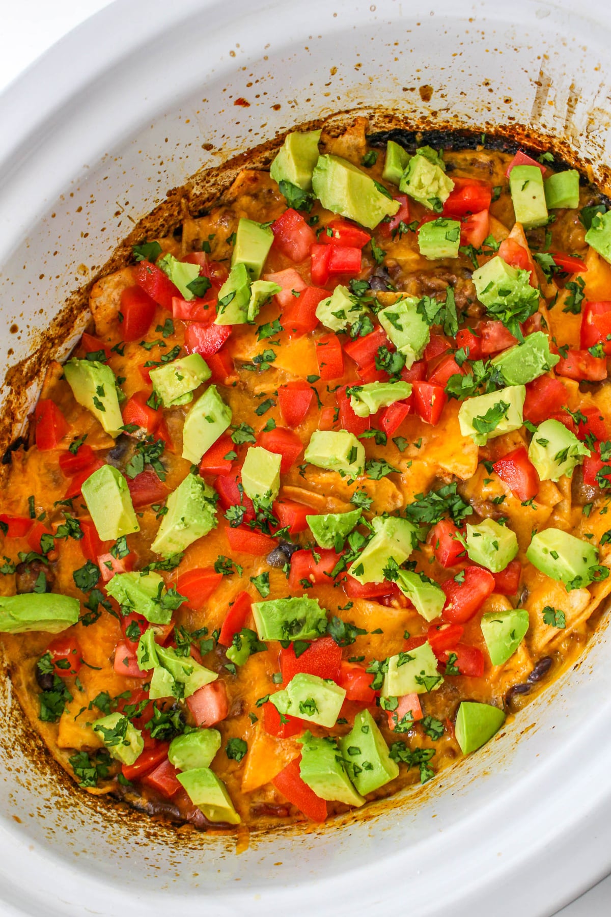Topped the Crockpot Mexican Casserole with the diced avocado, fresh cilantro, and tomatoes.