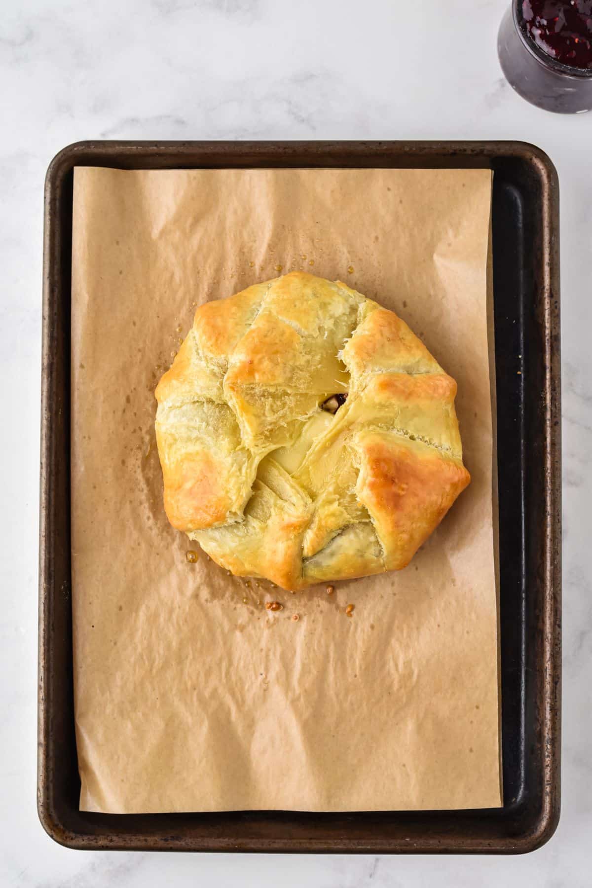 baked brie out of the oven on pan