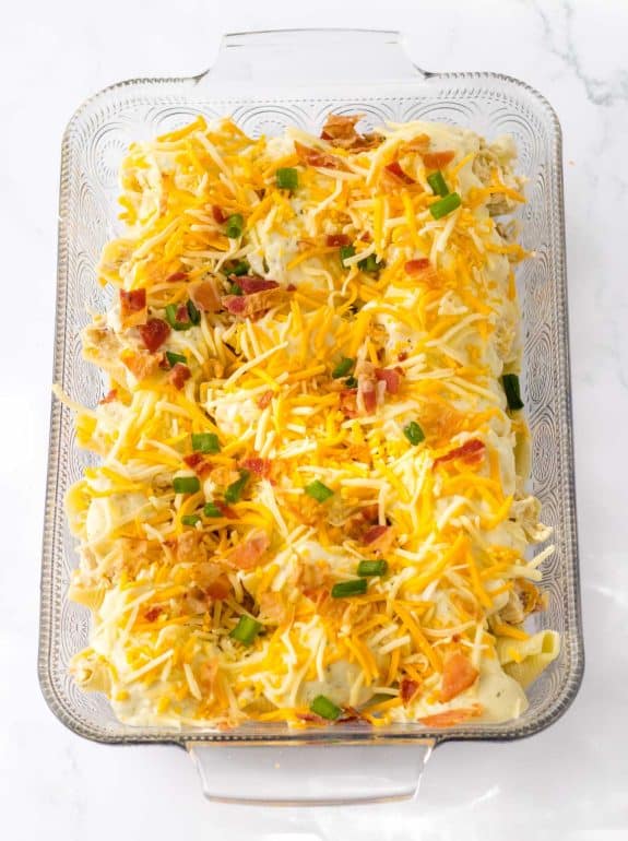 shredded cheese on top of crack chicken stuffed shells