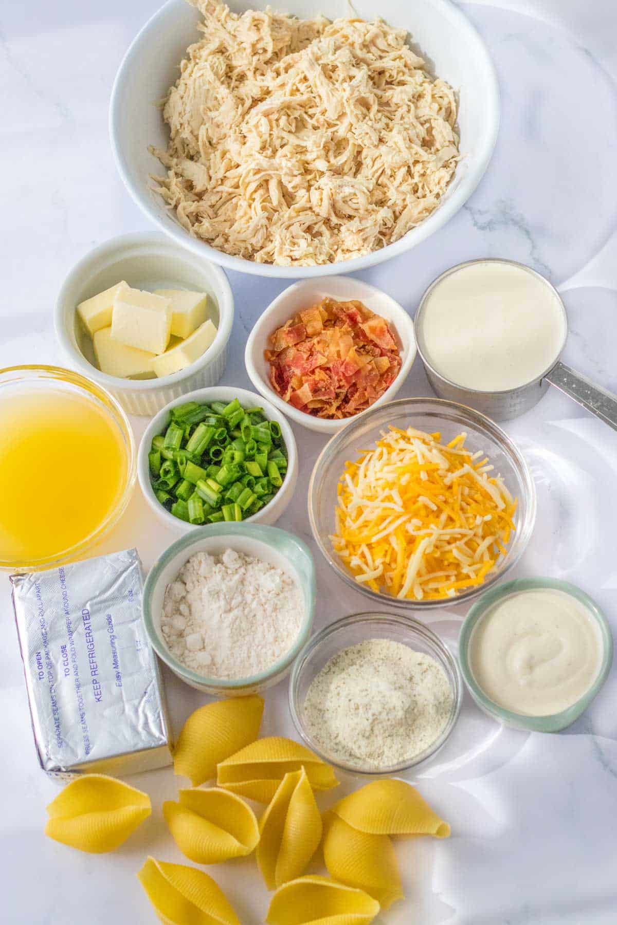 pasta and ingredients on white counter