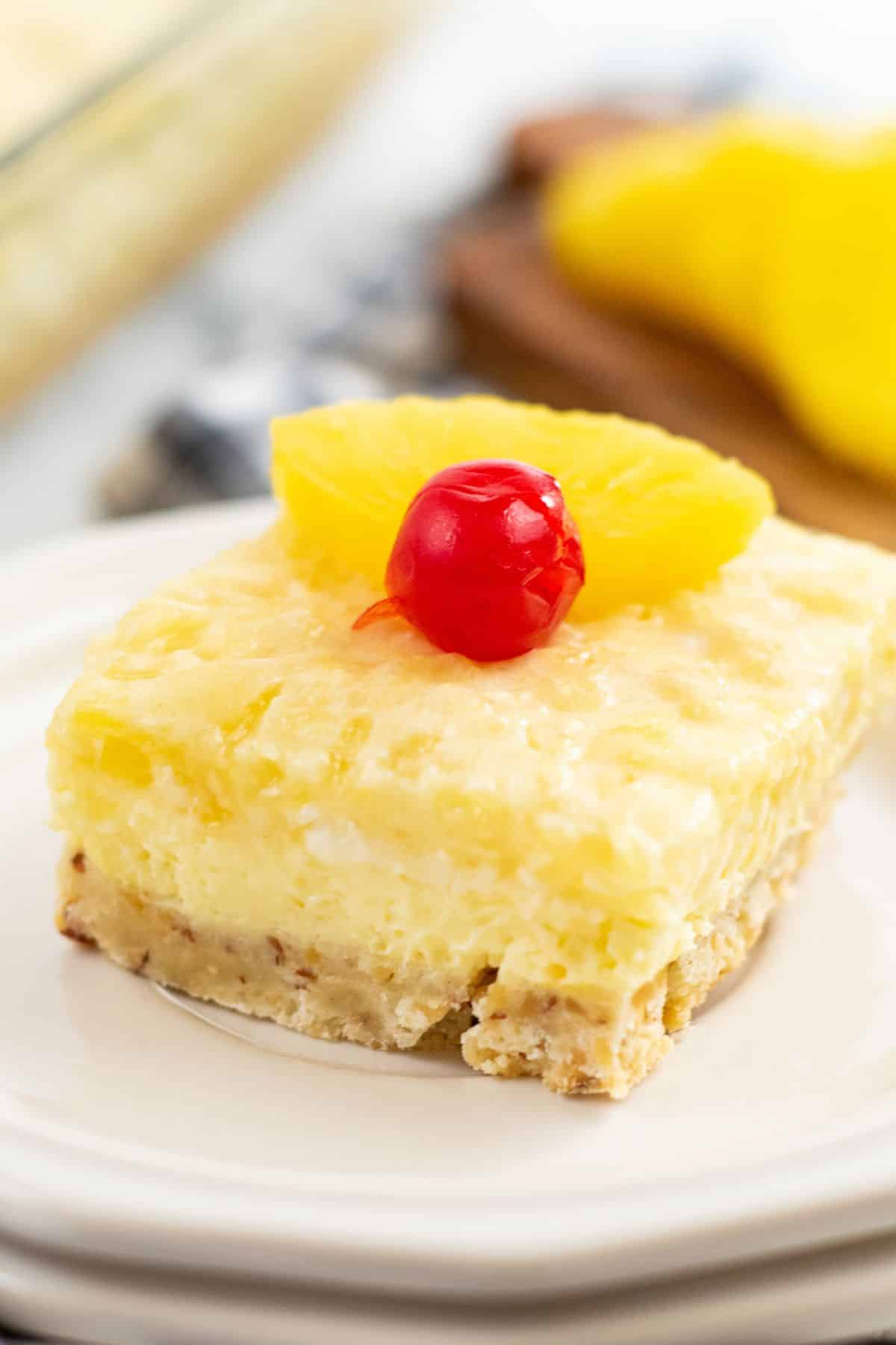 square slice of pineapple cheesecake