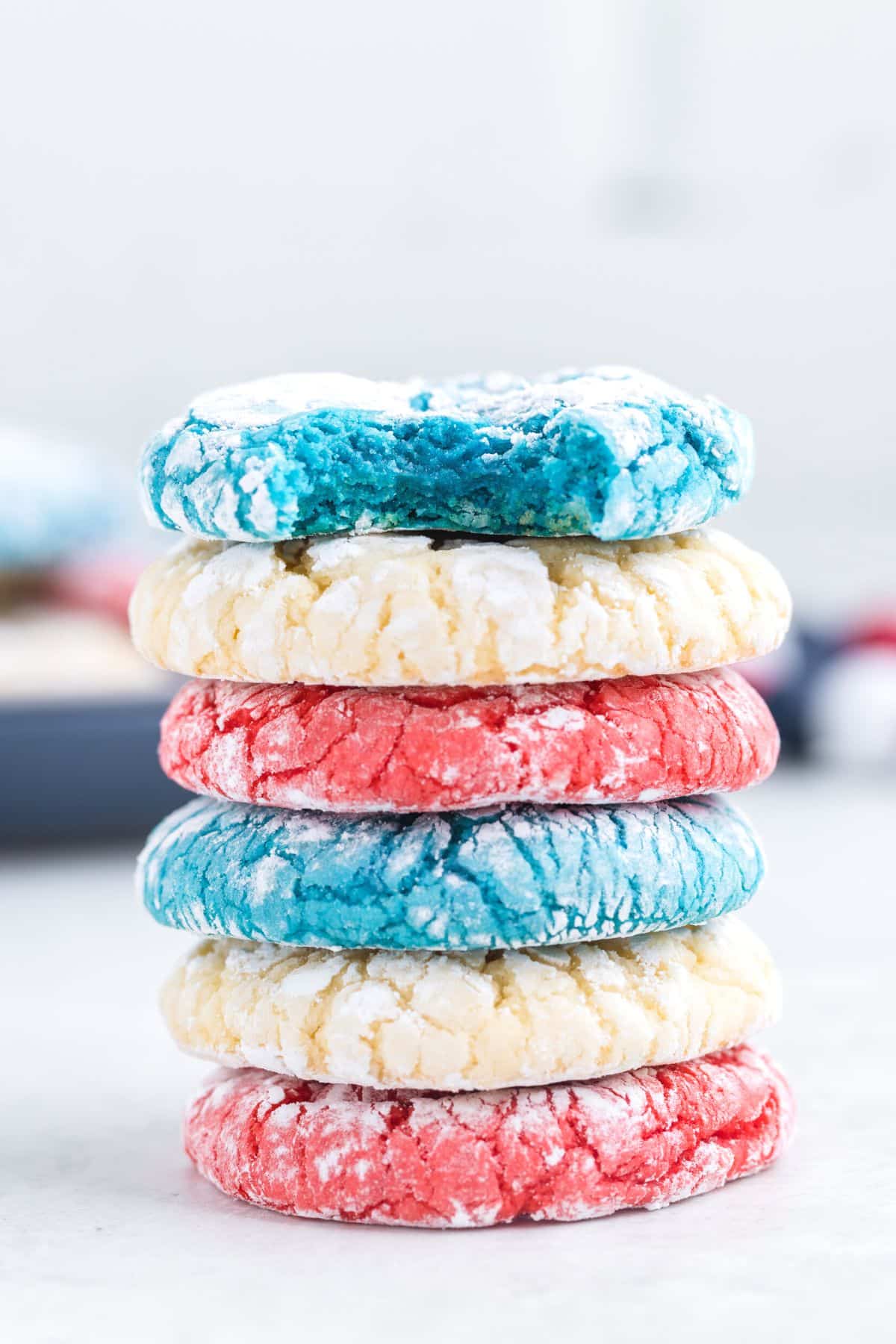 blue, white and red crinkle cookies stacked on top of each other
