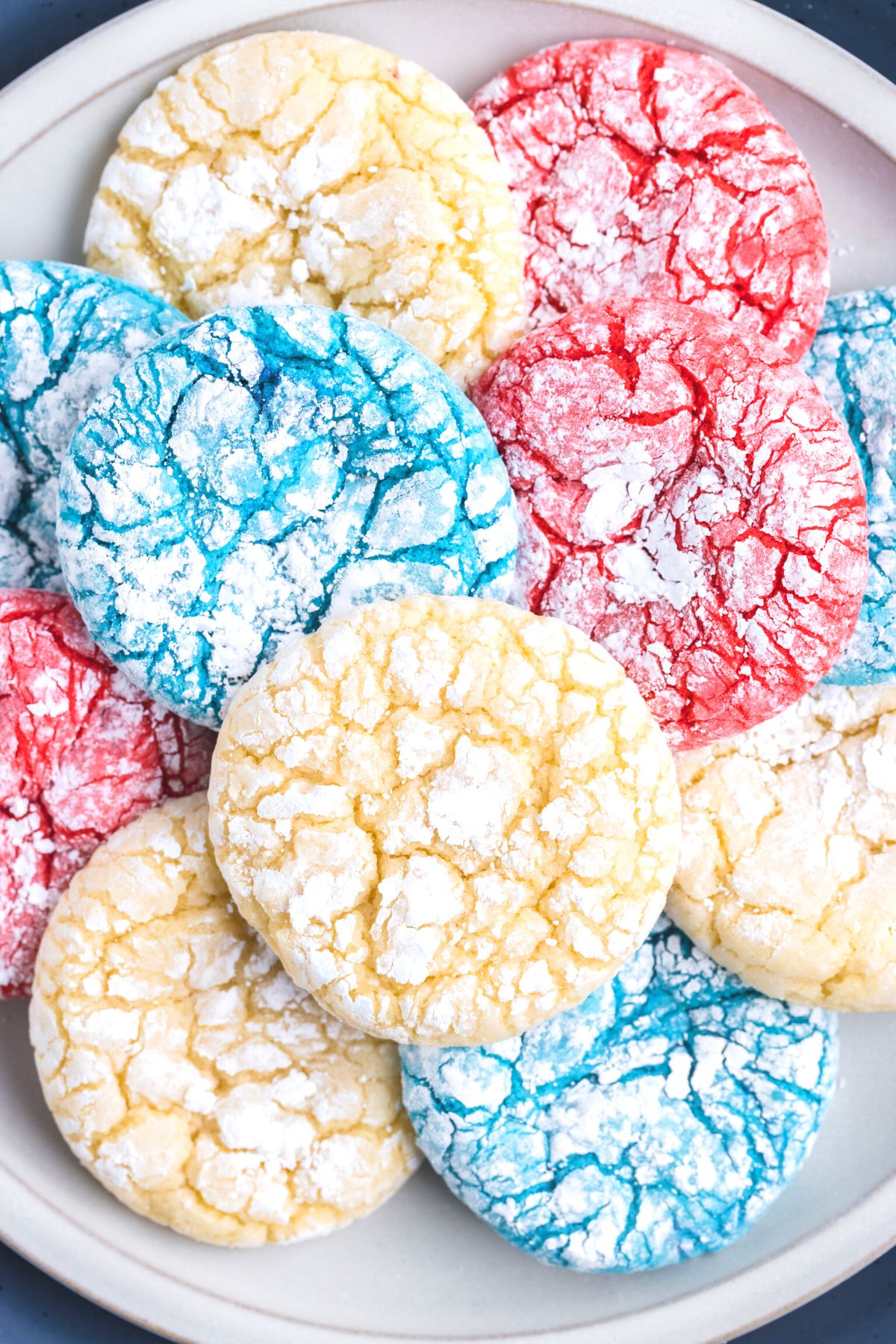 white, blue, and red crinkle cookies in white plate