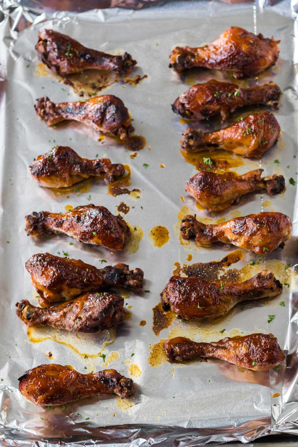 Place the Crockpot BBQ Drumsticks in a tray and brush the remaining sauce over them.