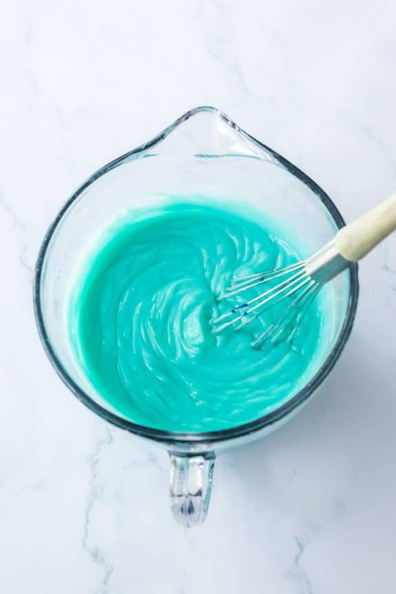teal frosting with whisk
